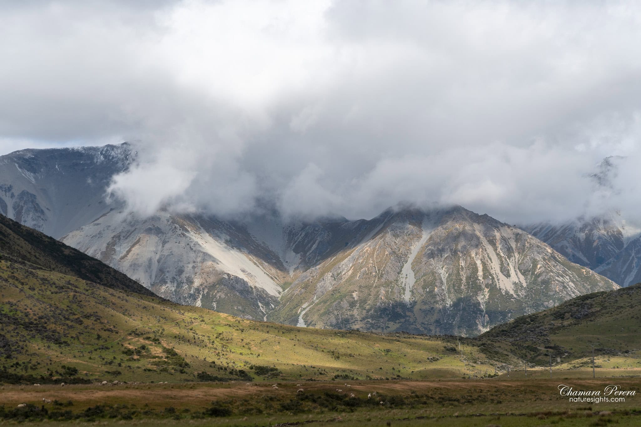 Arthur's Pass mountains with swirling clouds TranzAlpine New Zealand