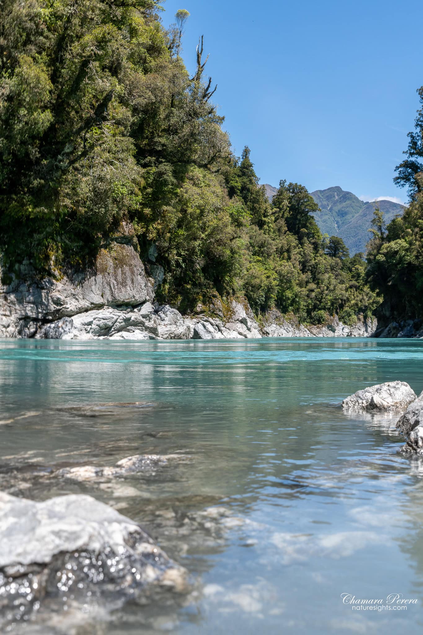 crystal clear water at Hokitika Gorge river edge New Zealand