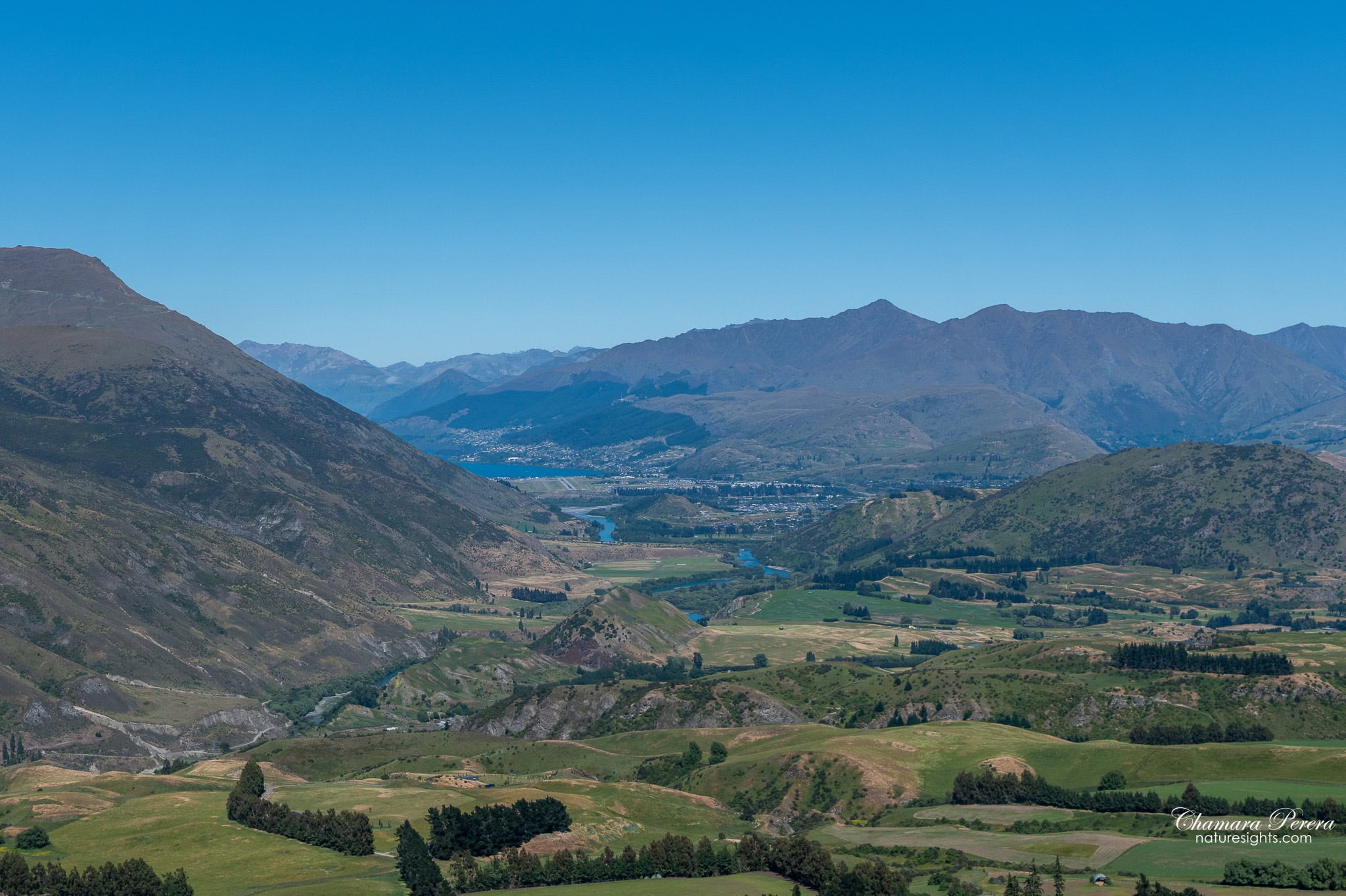 Crown Range Road looking back toward Queenstown lake New Zealand