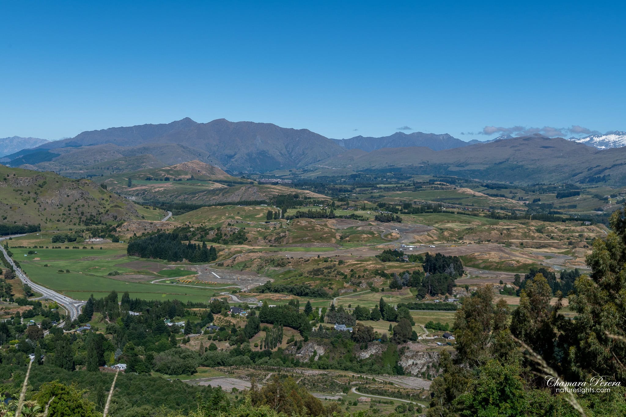Crown Range Road panoramic view over Queenstown valley New Zealand