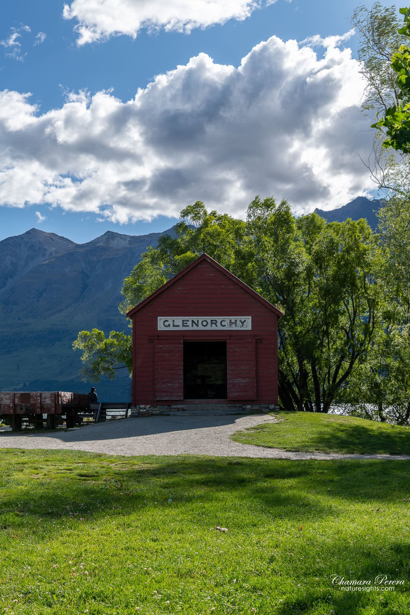 Glenorchy red boathouse and Lake Wakatipu mountains New Zealand