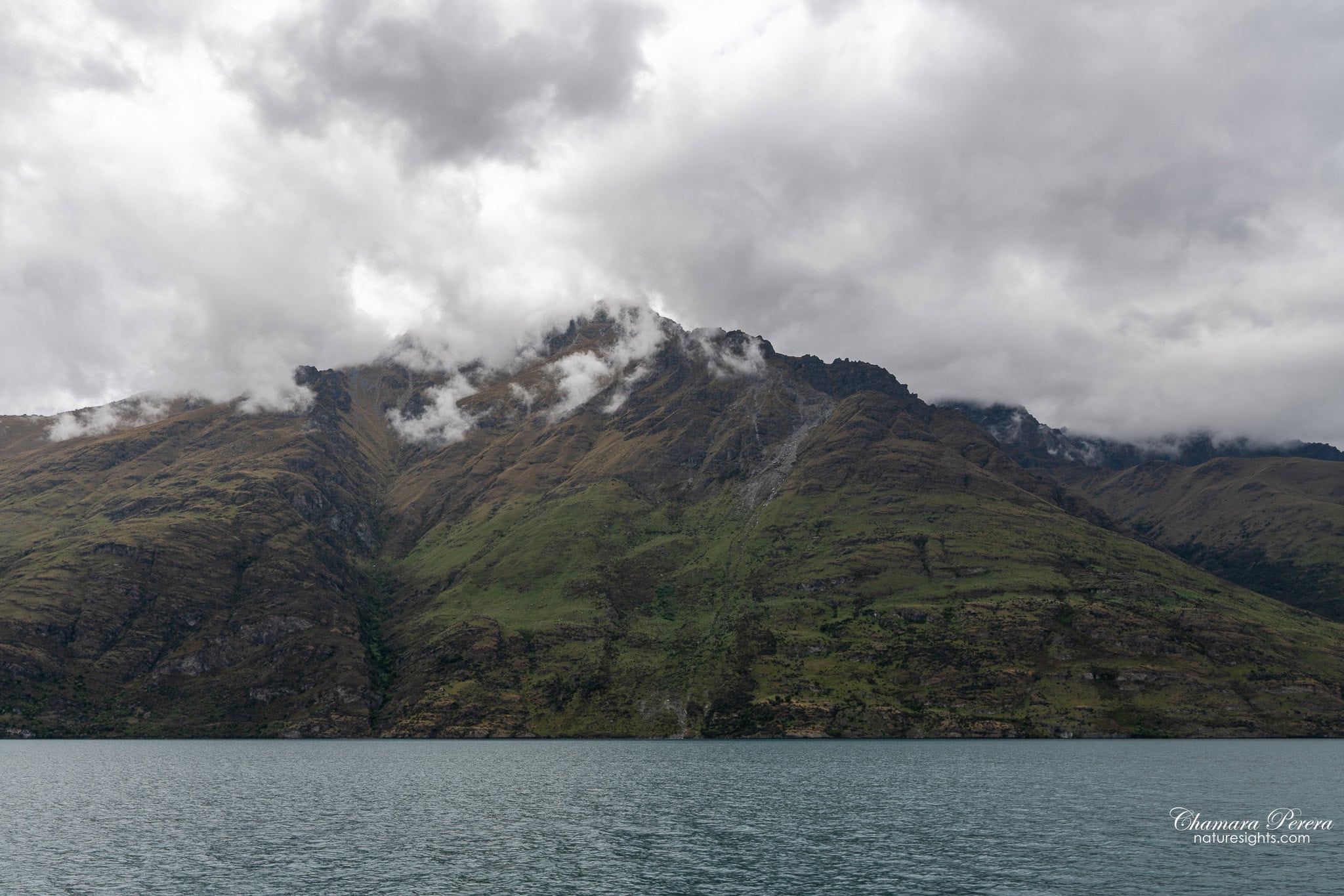 Mountain peak with cloud Lake Wakatipu Queenstown New Zealand