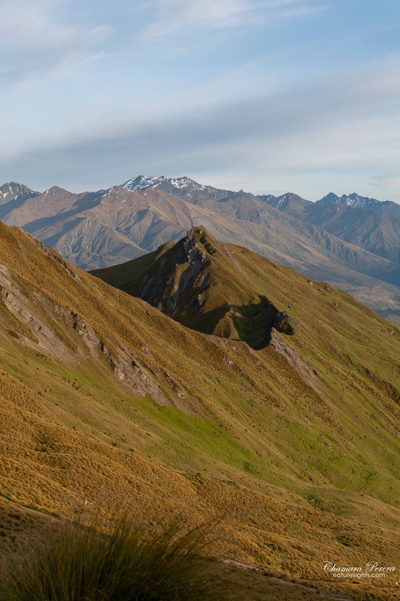 Roy's Peak rocky ridge with snow-capped mountains New Zealand