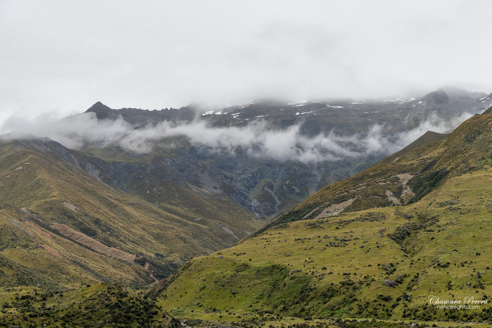 Aoraki Mount Cook National Park mountain ranges with low cloud New Zealand