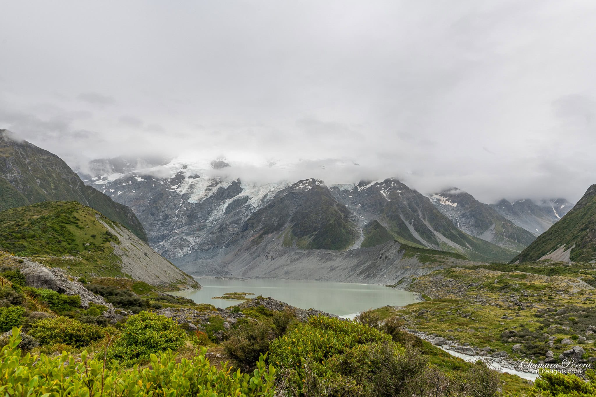 Mueller Lake milky green water with glaciers Hooker Valley Track New Zealand