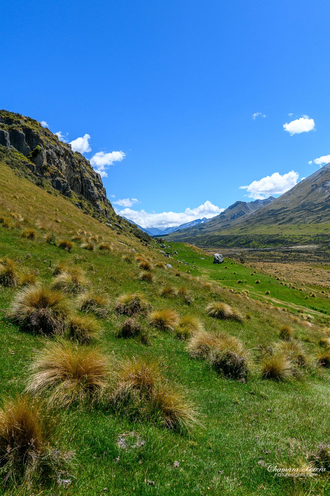 Rocky escarpment and valley view partway up Mount Sunday New Zealand