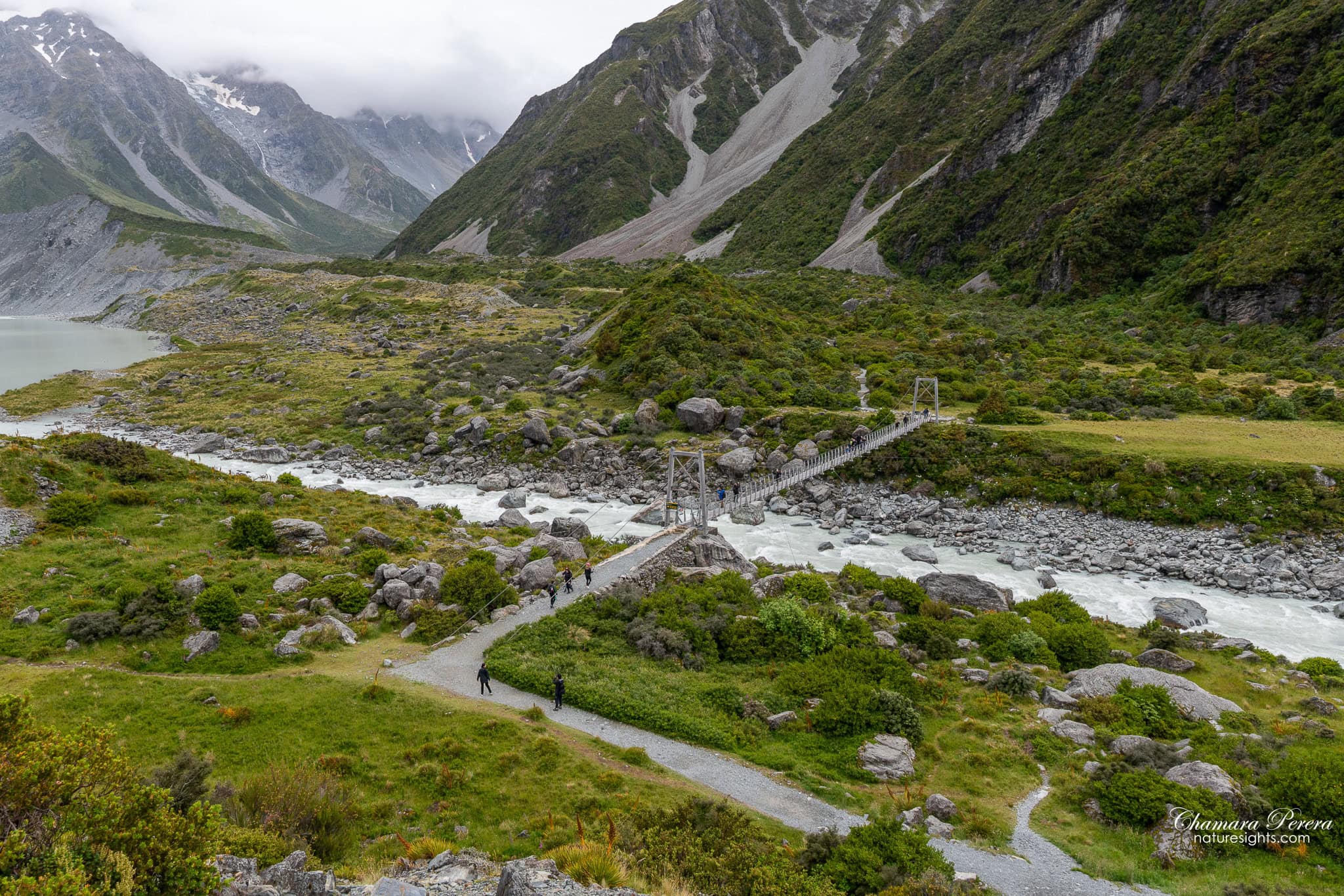 overview of swing bridge on Hooker Valley Track with Hooker Lake behind New Zealand